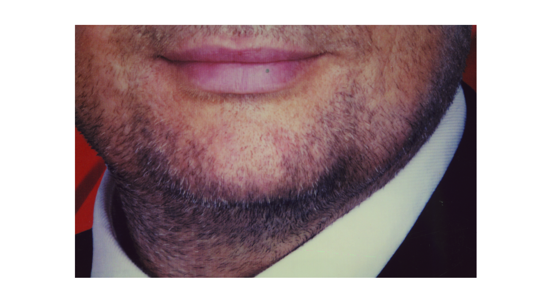 Photograph of a man's chin, neck and collar from The Powers That Be photobook